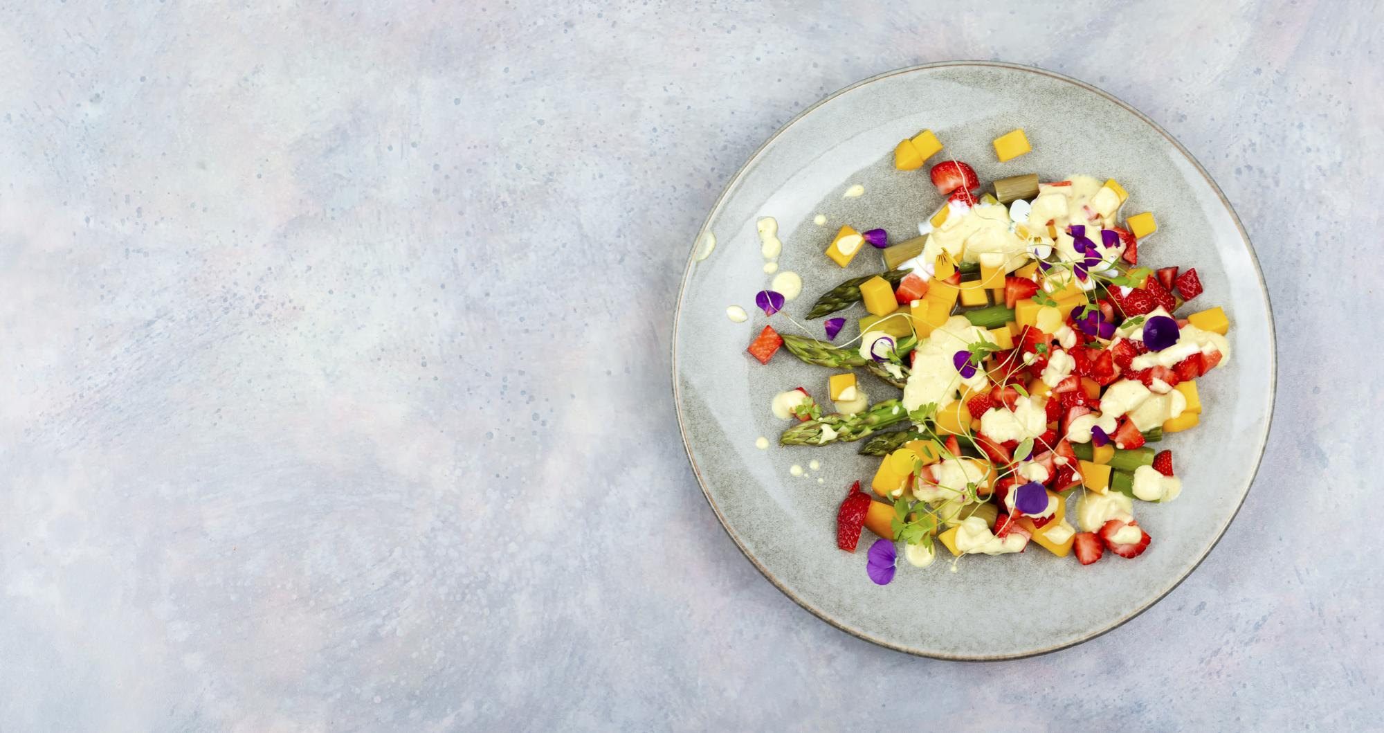 Plated seasonal salad with edible flowers